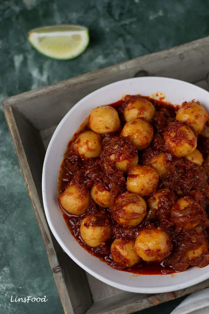 fishballs covered in spicy red sauce