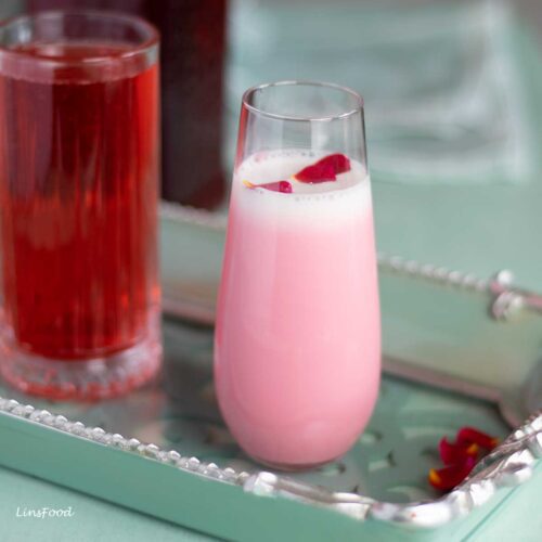 Sirap bandung in a tall glass (rose milk), with rose syrup on the side