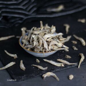 ikan bilis, dried anchovies in a small white bowl