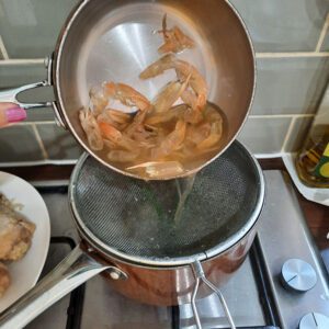 straining homemade prawn stock