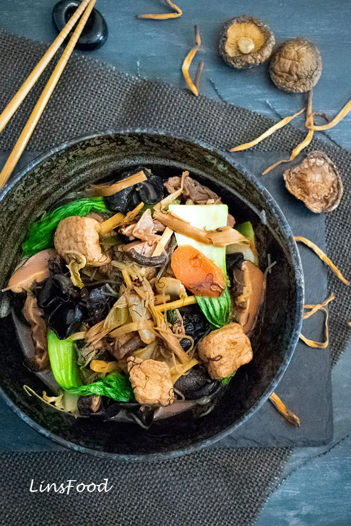 Lo Han Chai, braised vegetables in black bowl
