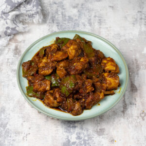 plate of sweet and spicy chicken with green peppers