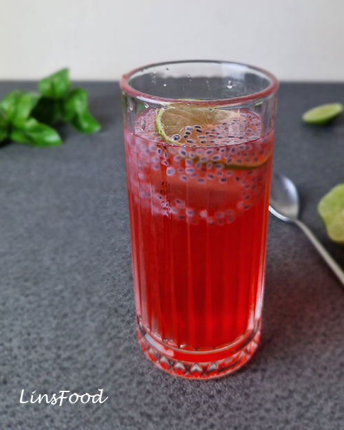 Sirap limau selasih with rose syrup, lime and soaked basil seeds served over ice.